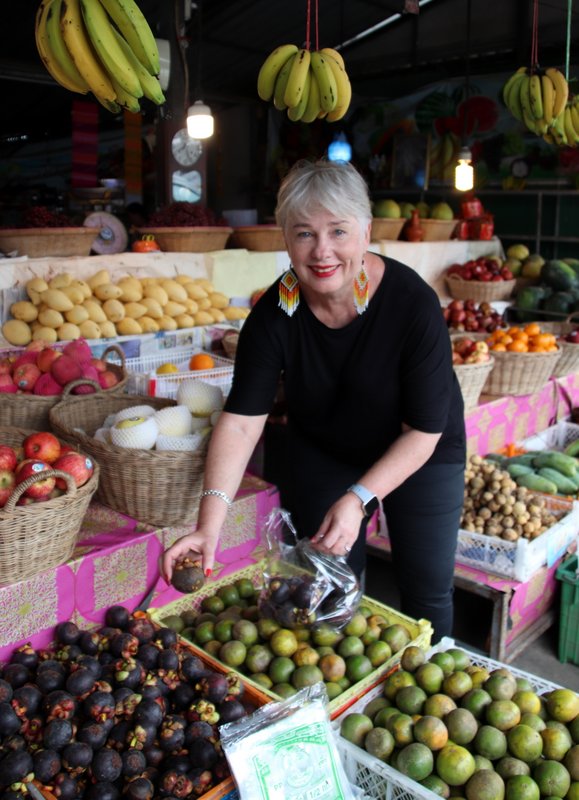 Kerry Heaney gathering mangosteens at a local market on Koh Samui