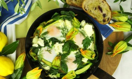 Santorini-inspired baked eggs with zucchini flowers, feta, spinach and herbs