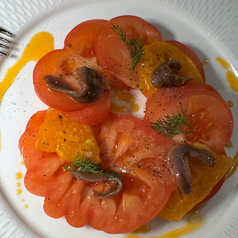 Heirloom tomatoes with anchovy oil at Aloria